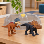 Piatnitzkysaurus and Einiosaurus in their revealed colors with the empty battle arena and sponge on a playroom table.