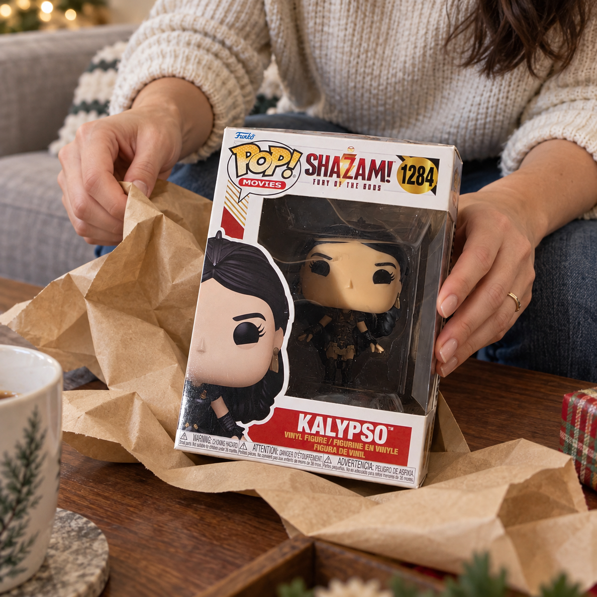 Boxed Funko Pop! Kalypso #1284 being unwrapped from gift paper.