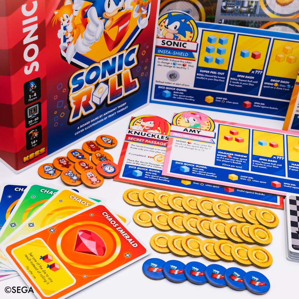 Product component image for KESS Sonic Roll board game showing the retail box, cards, tokens, and rulebook.