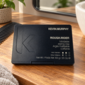 KEVIN.MURPHY ROUGH.RIDER 100 g closed black case beside a comb in a grooming-preparation setting.