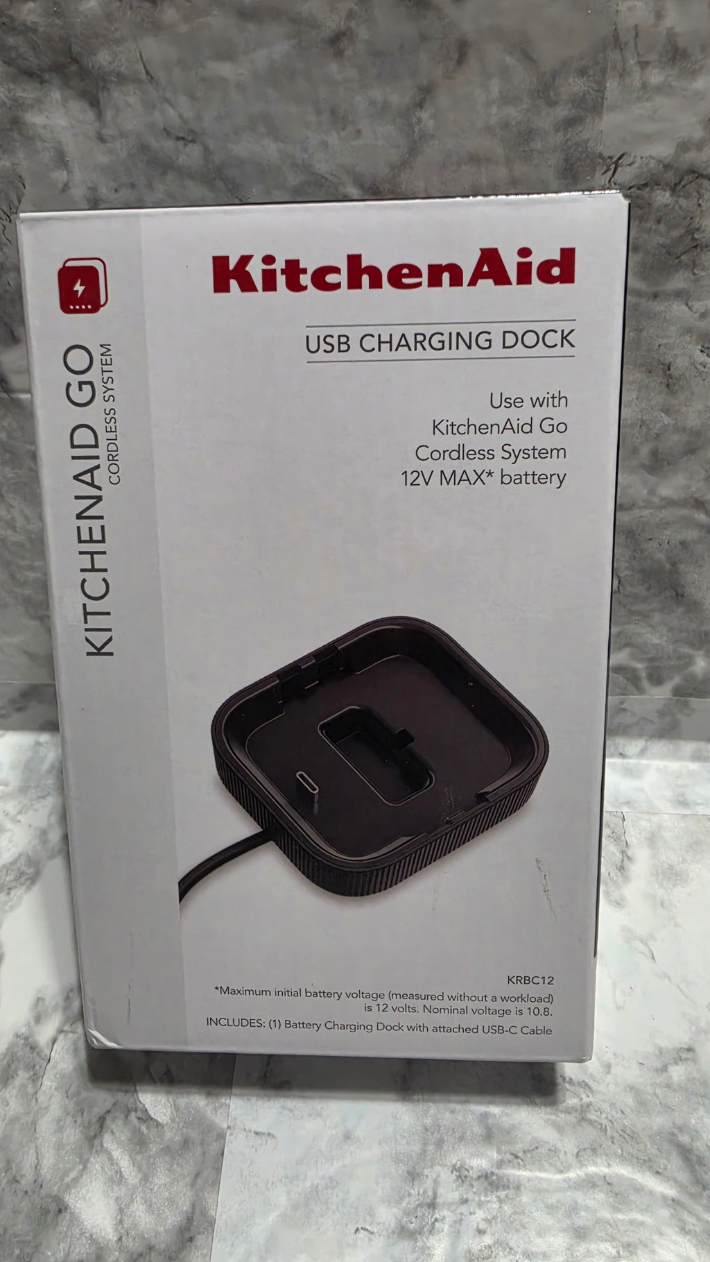 KitchenAid Go KRBC12 USB charging dock retail box front, showing the dock and attached cable