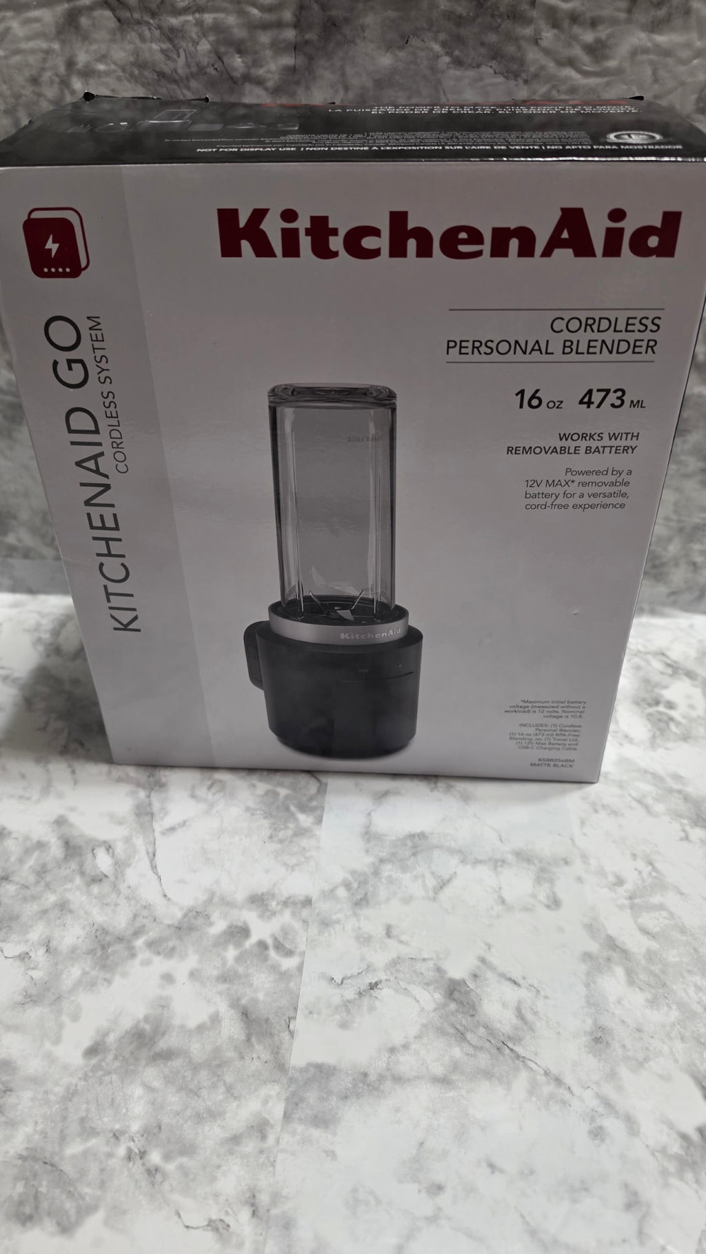 Front of the KitchenAid Go KSBR256BM cordless personal blender box, showing the matte black 16 oz battery-included model