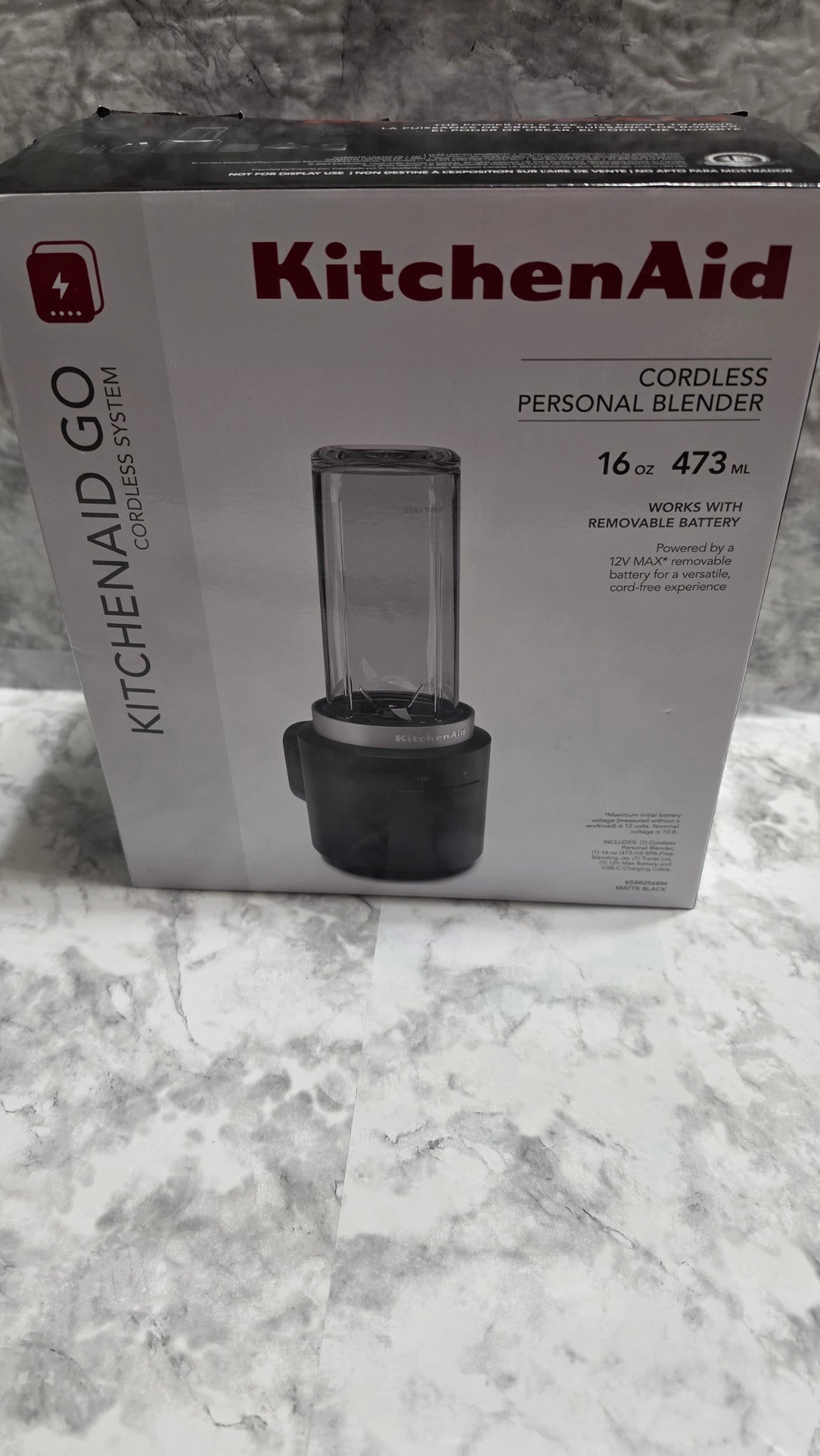 Front of the KitchenAid Go KSBR256BM cordless personal blender box, showing the matte black 16 oz battery-included model