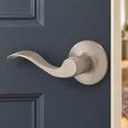 AI-staged lifestyle view of the satin nickel Kwikset Layton left-hand dummy lever on a charcoal-blue closet door