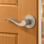 AI-staged lifestyle view of the satin nickel Kwikset Layton left-hand dummy lever on an oak closet door