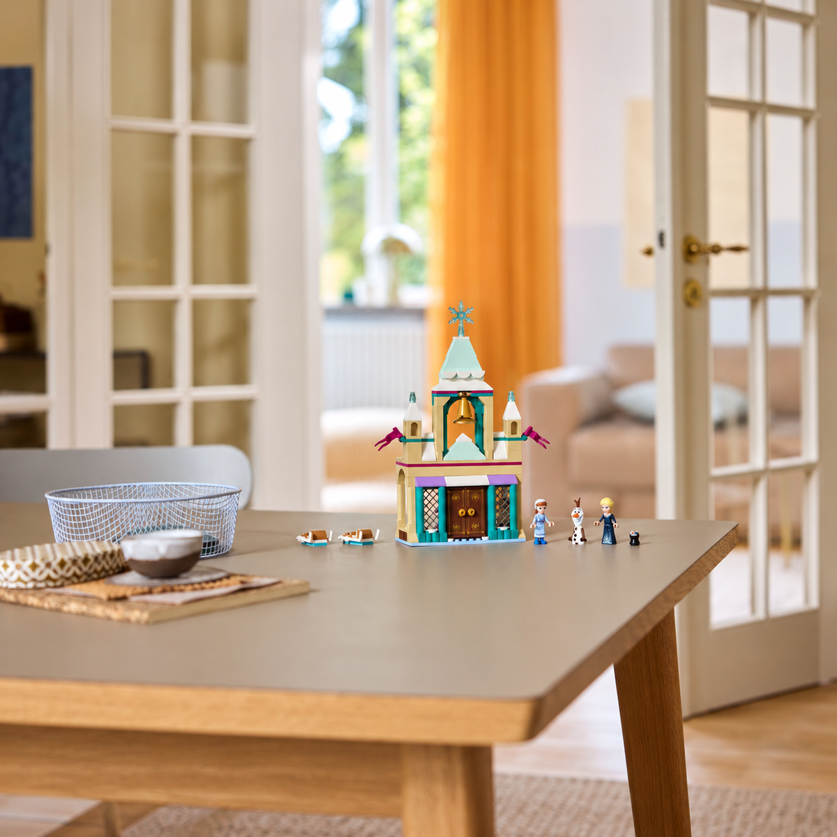 LEGO Arendelle Castle 43265 with Anna, Elsa, Olaf and two sleds displayed on a table