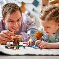 Adult and child playing with the LEGO Star Wars AT-ST 75332 walker, speeder and Ewok lookout.