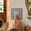Pressing a Legrand adorne Magnesium paddle switch in an entryway