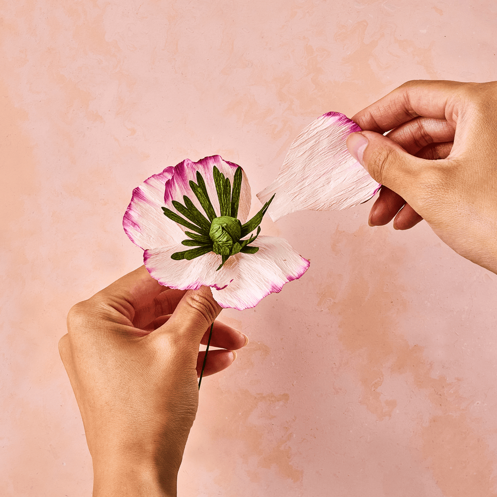 Attaching paper petals while assembling a Lifelines FlowCrafts flower