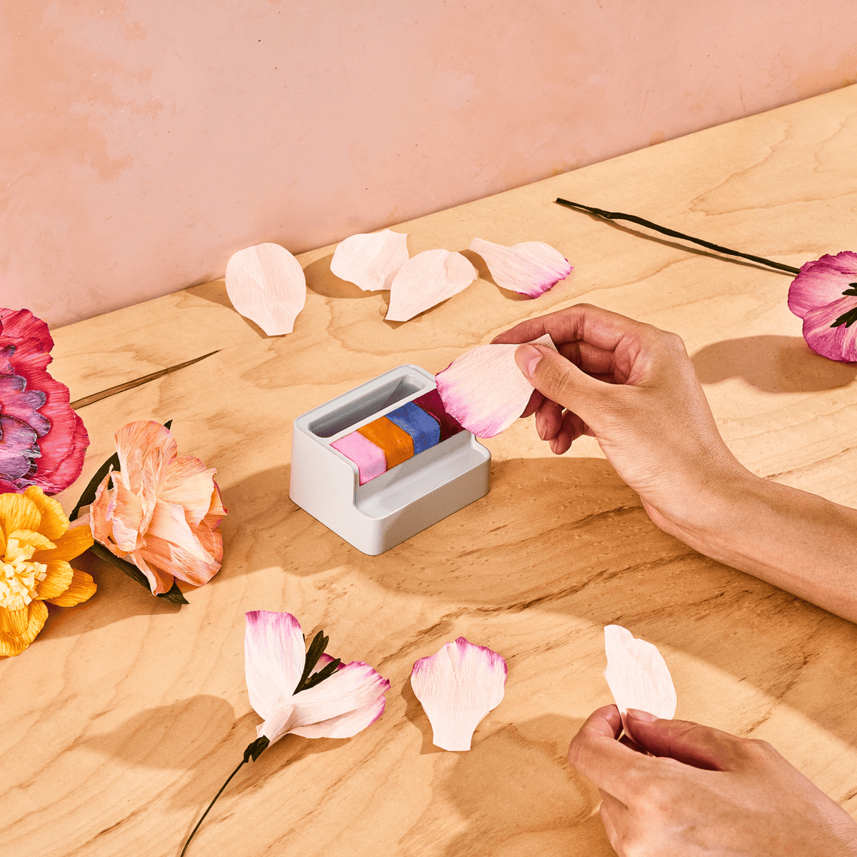 Customizing a Lifelines FlowCrafts paper flower petal with the included petal paint