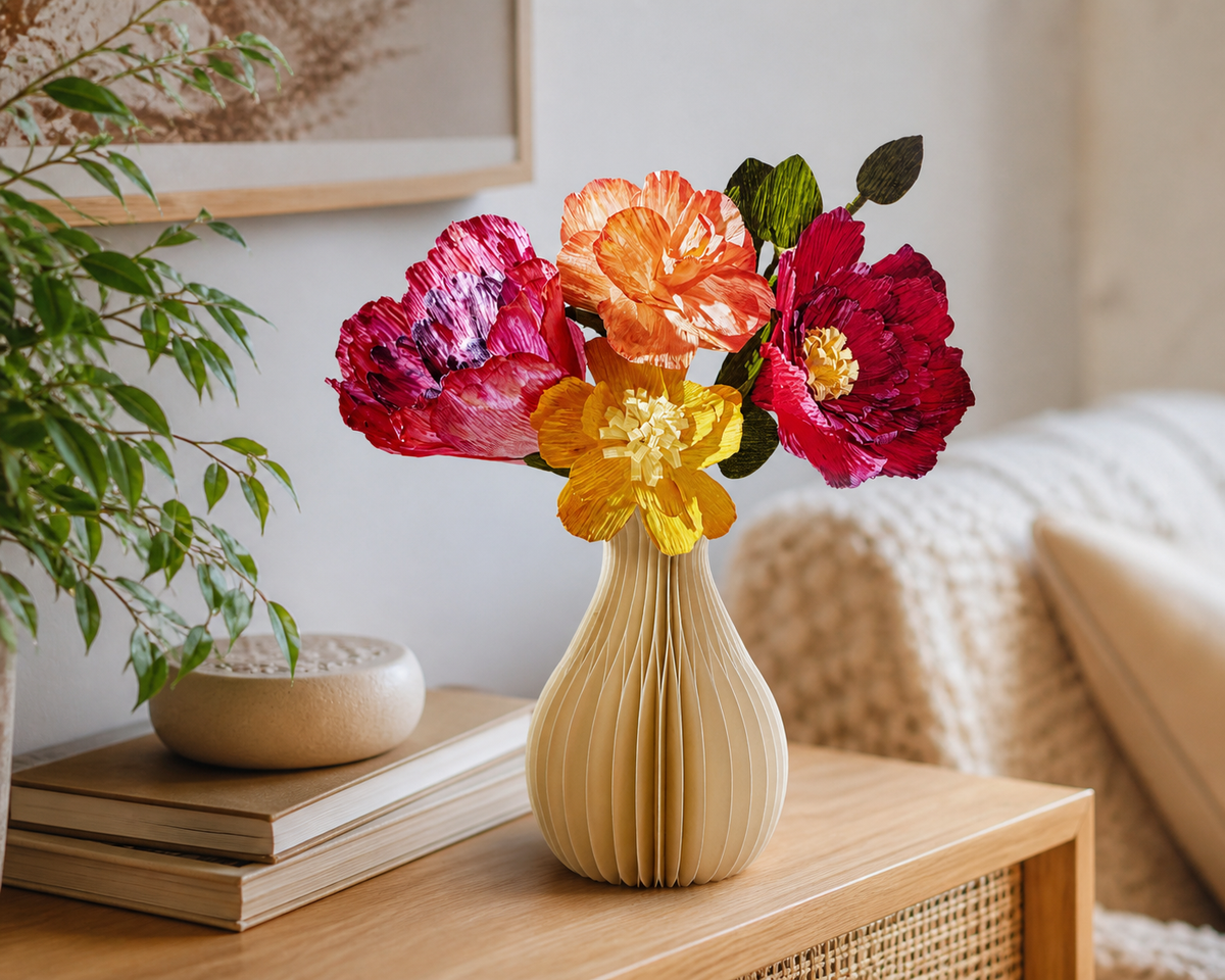 Illustrative lifestyle image of a colorful paper flower bouquet displayed as home decor