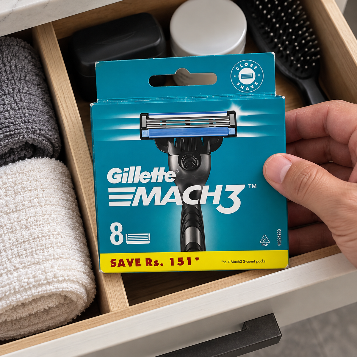 Placing a Gillette Mach3 Original eight-refill carton in a dry grooming drawer