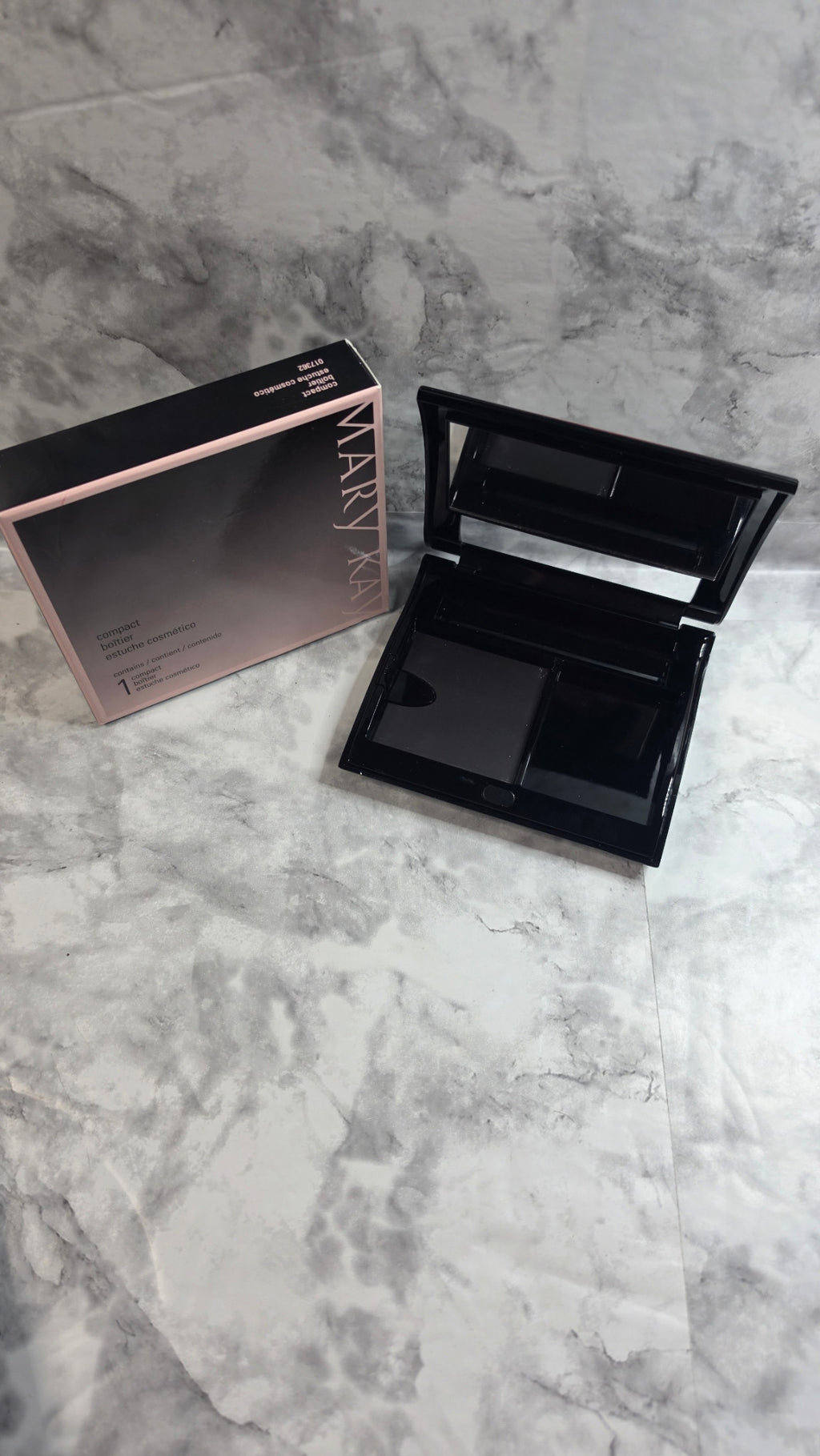 Original photograph: Mary Kay Compact 017362 open with empty magnetic refill well and accessory spaces beside its original box