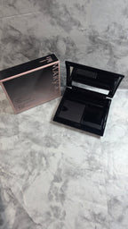 Original photograph: Mary Kay Compact 017362 open with empty magnetic refill well and accessory spaces beside its original box