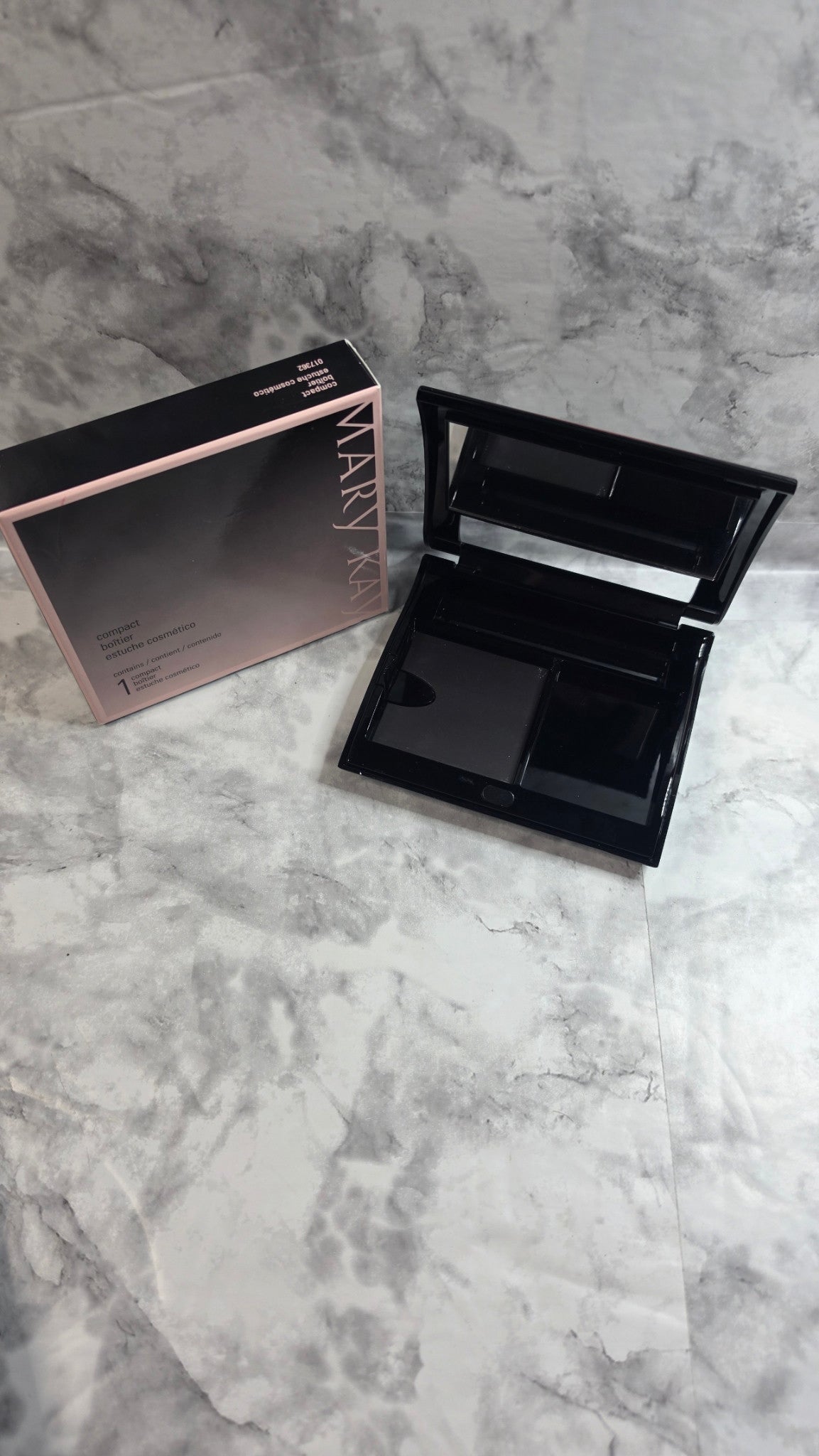 Original photograph: Mary Kay Compact 017362 open with empty magnetic refill well and accessory spaces beside its original box