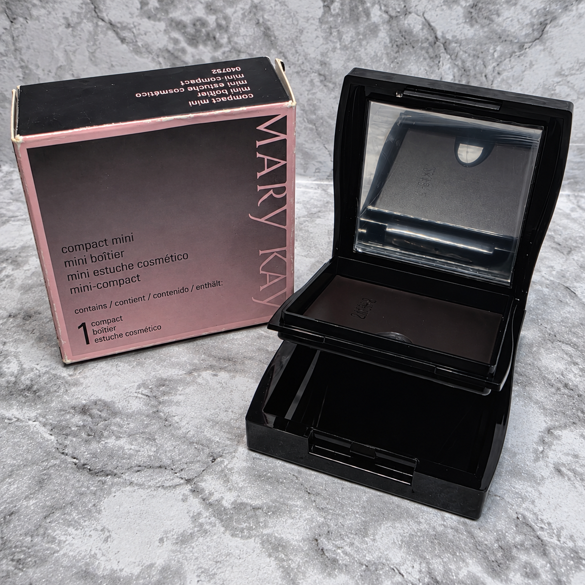 Mary Kay Compact Mini 040752 open and empty beside its original box