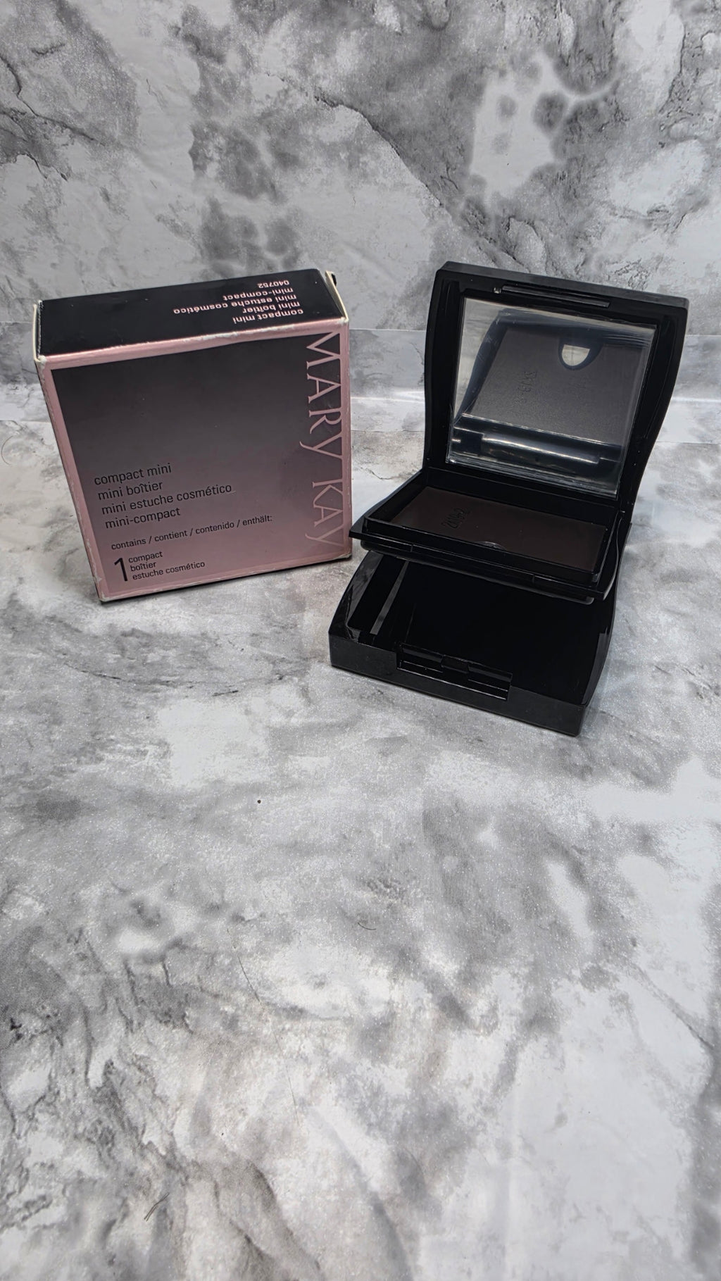 Original photograph: Mary Kay Compact Mini 040752 open and empty beside its original box