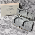 Mary Kay Foundation Compact 869100 with empty D-shaped refill well, mirror and sponge compartment beside its box