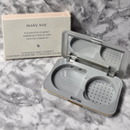 Mary Kay Foundation Compact 869100 with empty D-shaped refill well, mirror and sponge compartment beside its box