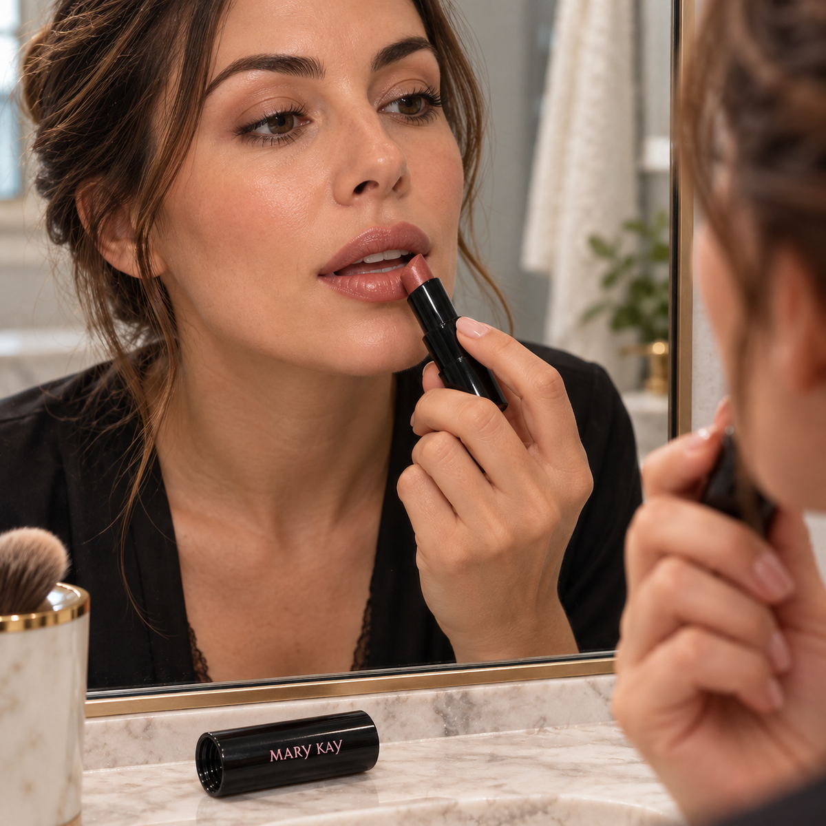 Adult applying Mary Kay Better Than Bare lipstick at a mirror