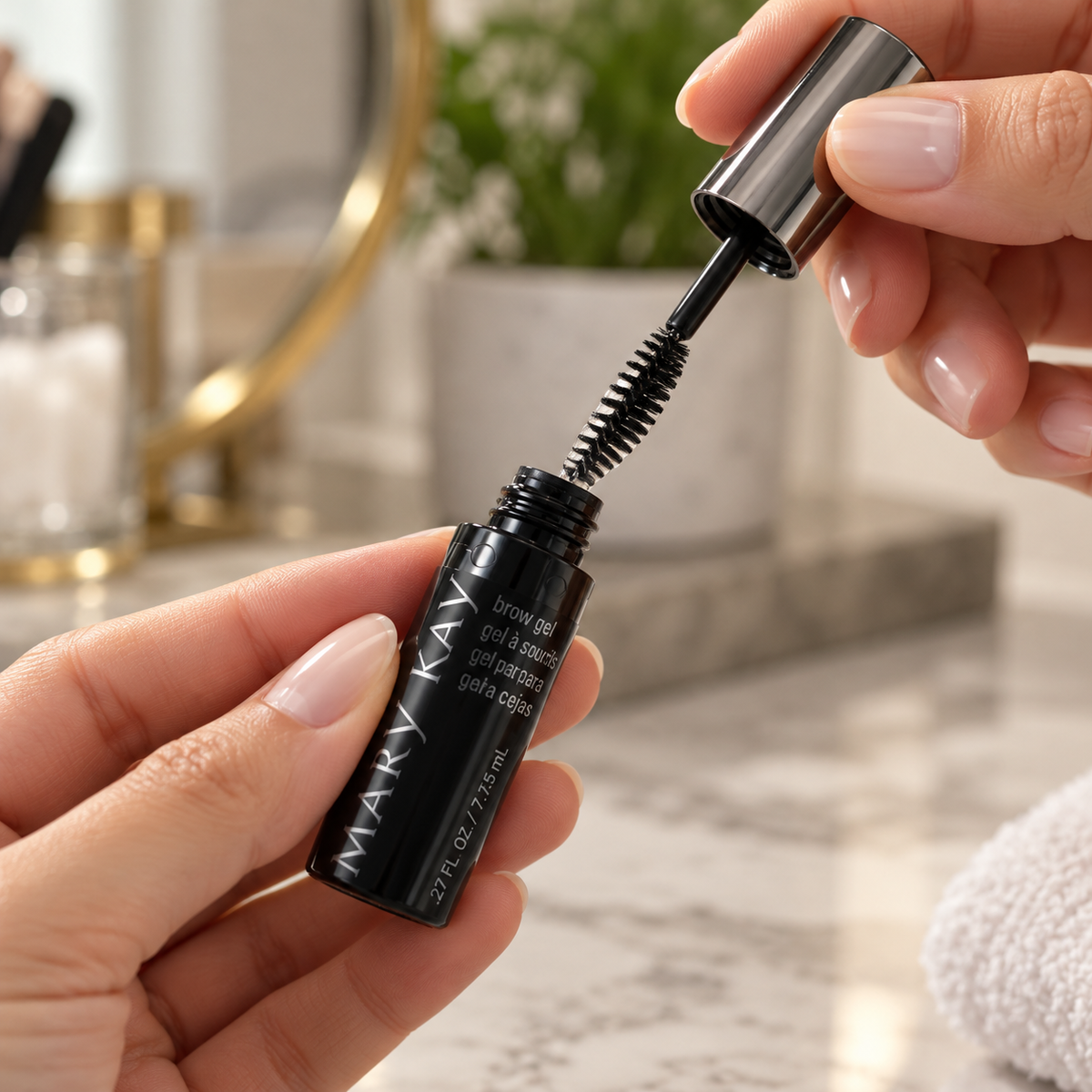 Withdrawing the spoolie from the Mary Kay Clear Brow Gel tube