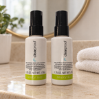 Styled lifestyle image of two Mary Kay Clear Proof Pore-Purifying Serum 1.75 oz bottles in a mirror vanity setting; props not included