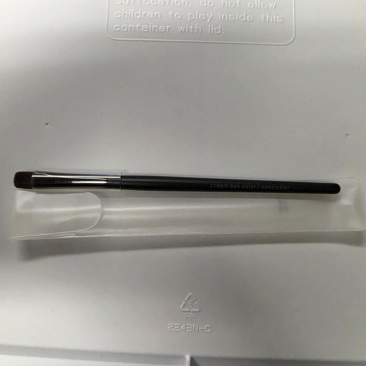 Actual Mary Kay Cream Eye Color and Concealer Brush in its protective sleeve