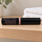 Mary Kay Dark Blonde brow tint on a pale bathroom shelf beside a folded white towel