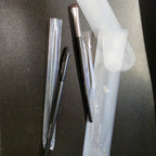 Actual new Mary Kay Eye Smudger brushes in protective sleeves with frosted storage pouches; black and chrome ferrule styles shown