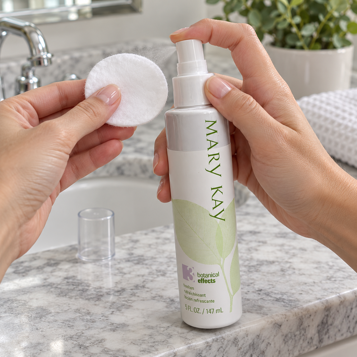 Mary Kay Botanical Effects Freshen Formula 3 being sprayed onto a cotton pad