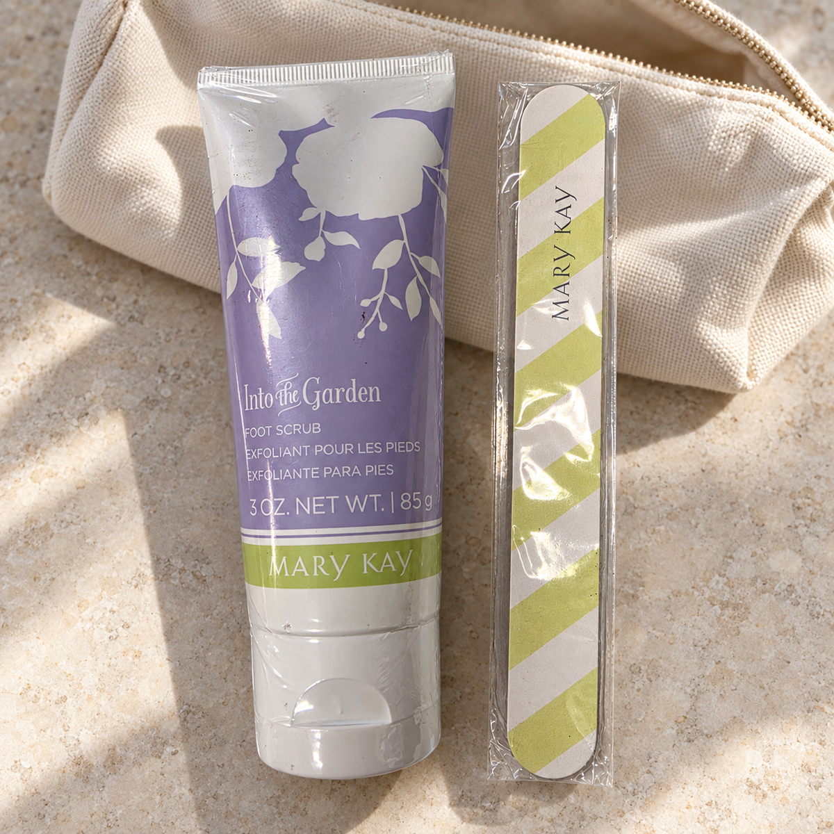 Mary Kay Into the Garden Foot Scrub 3 oz with free nail file beside toiletries