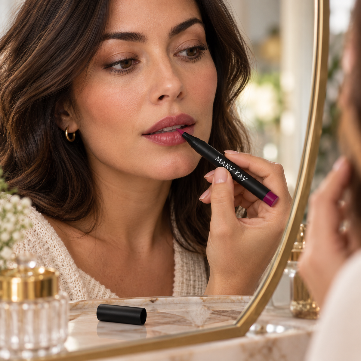 Adult applying Mary Kay Desert Flora Lip Tint