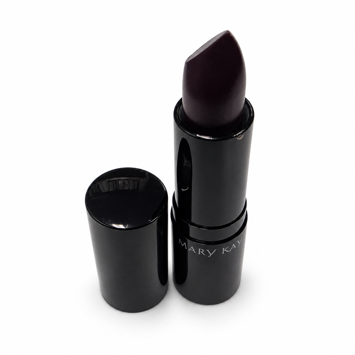 Mary Kay Puro Mirtillo matte lipstick and cap on a white background