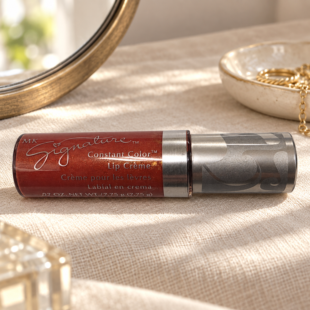 Mary Kay Tropical Spice Lip Crème on a linen vanity beside a mirror