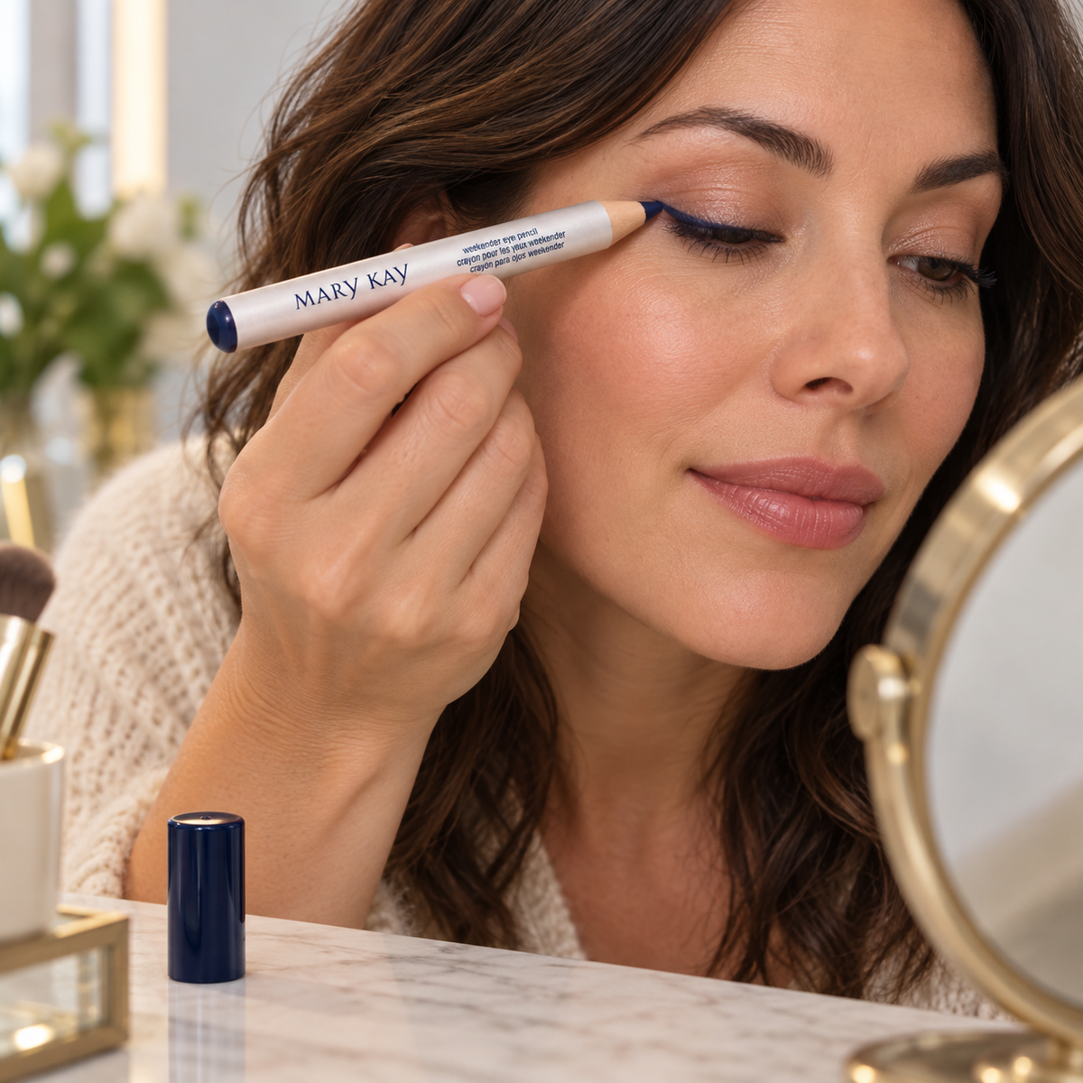 Adult lining the upper eyelid with Mary Kay Classic Navy Weekender pencil