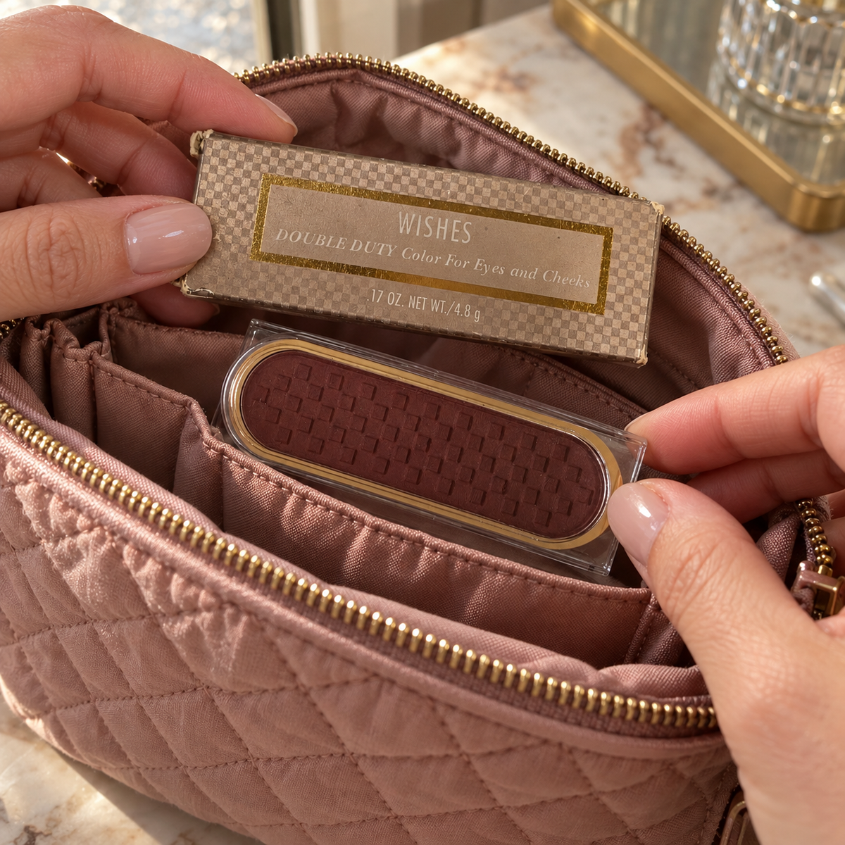 Packing the boxed Mary Kay Wishes powder in a makeup bag