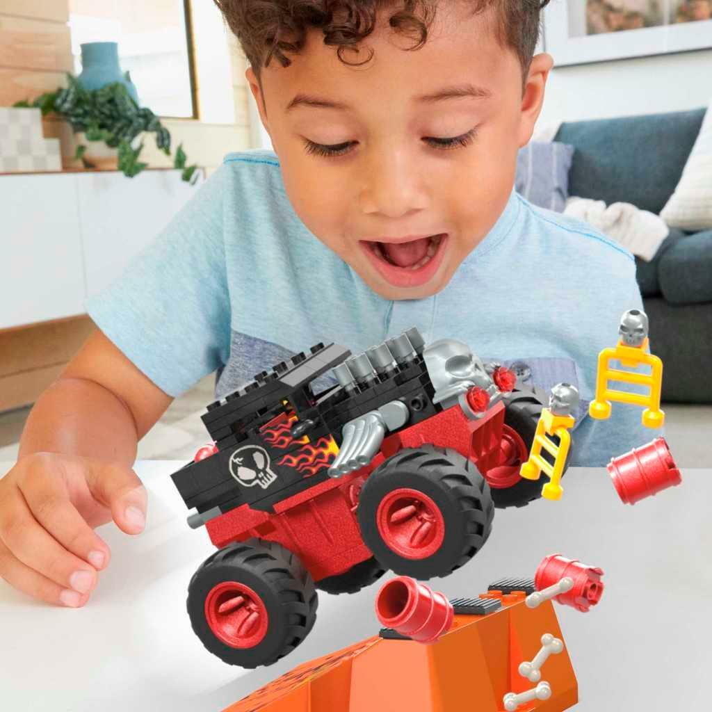 Bone Shaker monster truck jumping over the ramp during play, manufacturer view