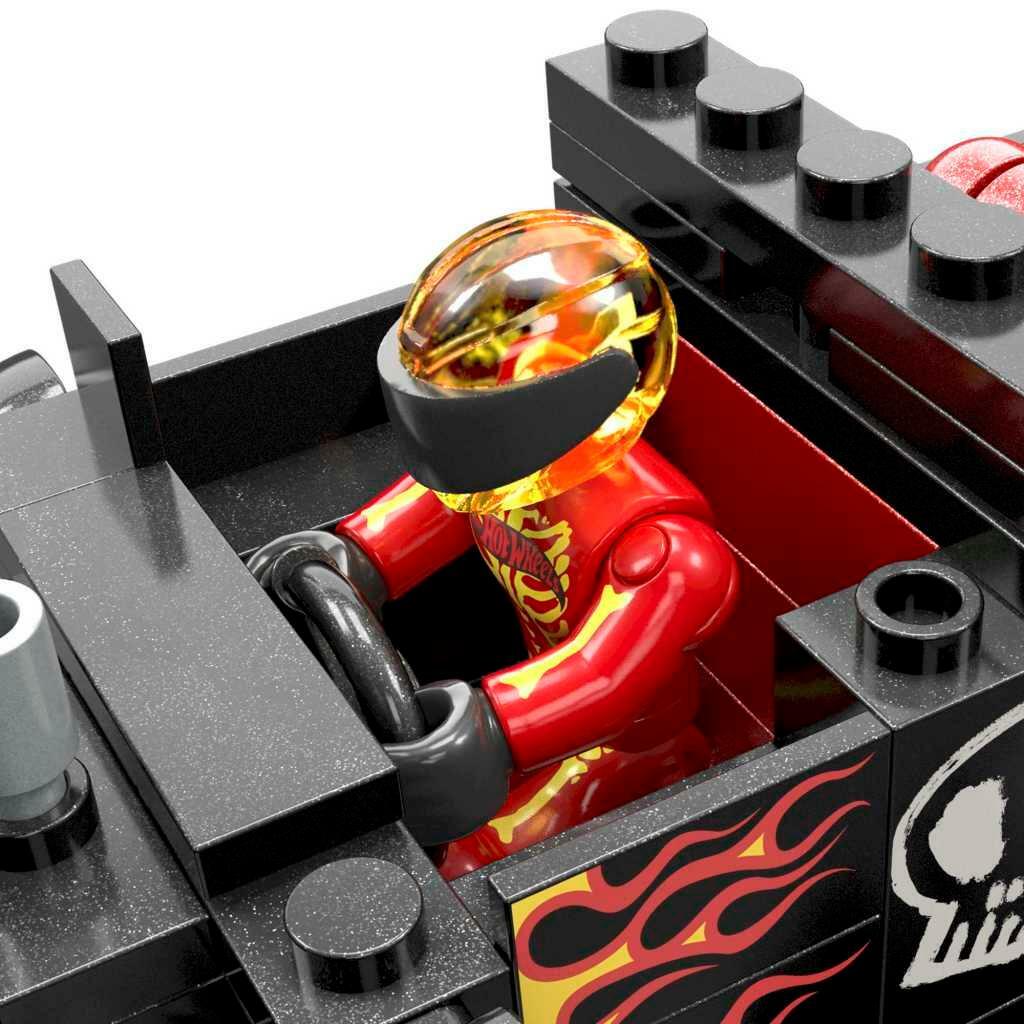 Close-up of the included red driver seated in the Bone Shaker truck