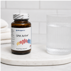 AI-generated countertop context image of Metagenics SPM Active 60 softgels beside a glass of water.