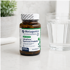 AI-generated countertop context image of Metagenics UltraFlora Spectrum Probiotic 60 capsules beside a glass of water.