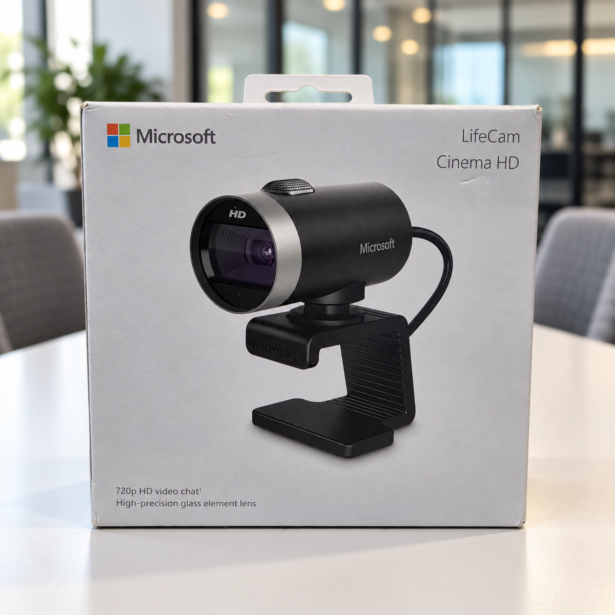 Microsoft LifeCam Cinema retail box staged in a meeting room