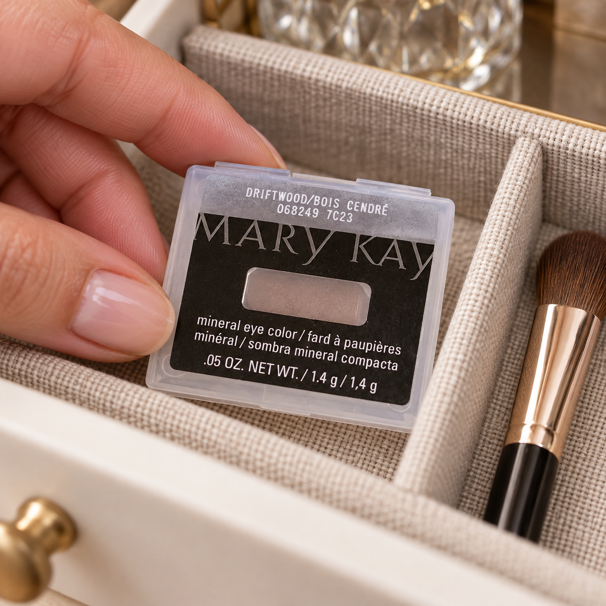 Placing a closed Driftwood Mineral Eye Color refill case in a vanity organizer