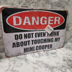 Owner photograph of the new MINI COOPER novelty metal sign in its original packaging.