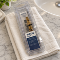 Moen 1225B replacement cartridge in its clear package on a folded cloth beside a sink.