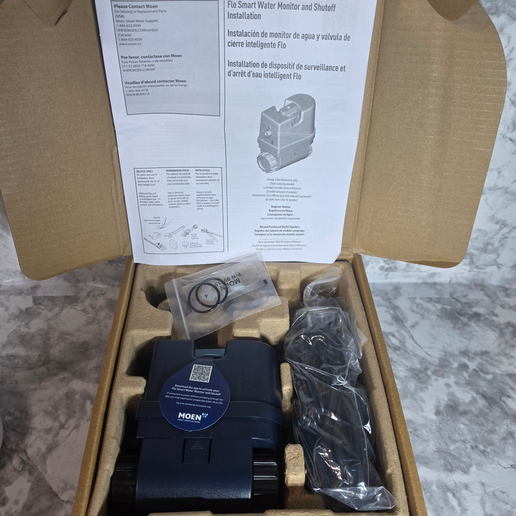 Actual new Moen Flo Smart Water Monitor and Shutoff 900-001 in protective packaging with included installation components
