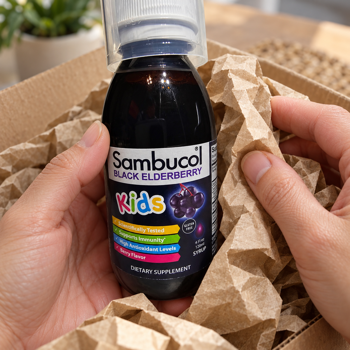 Unpacking a Sambucol Kids 4 fl oz bottle