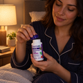 Adult opening a Natrol Melatonin 5 mg bottle during a bedtime routine