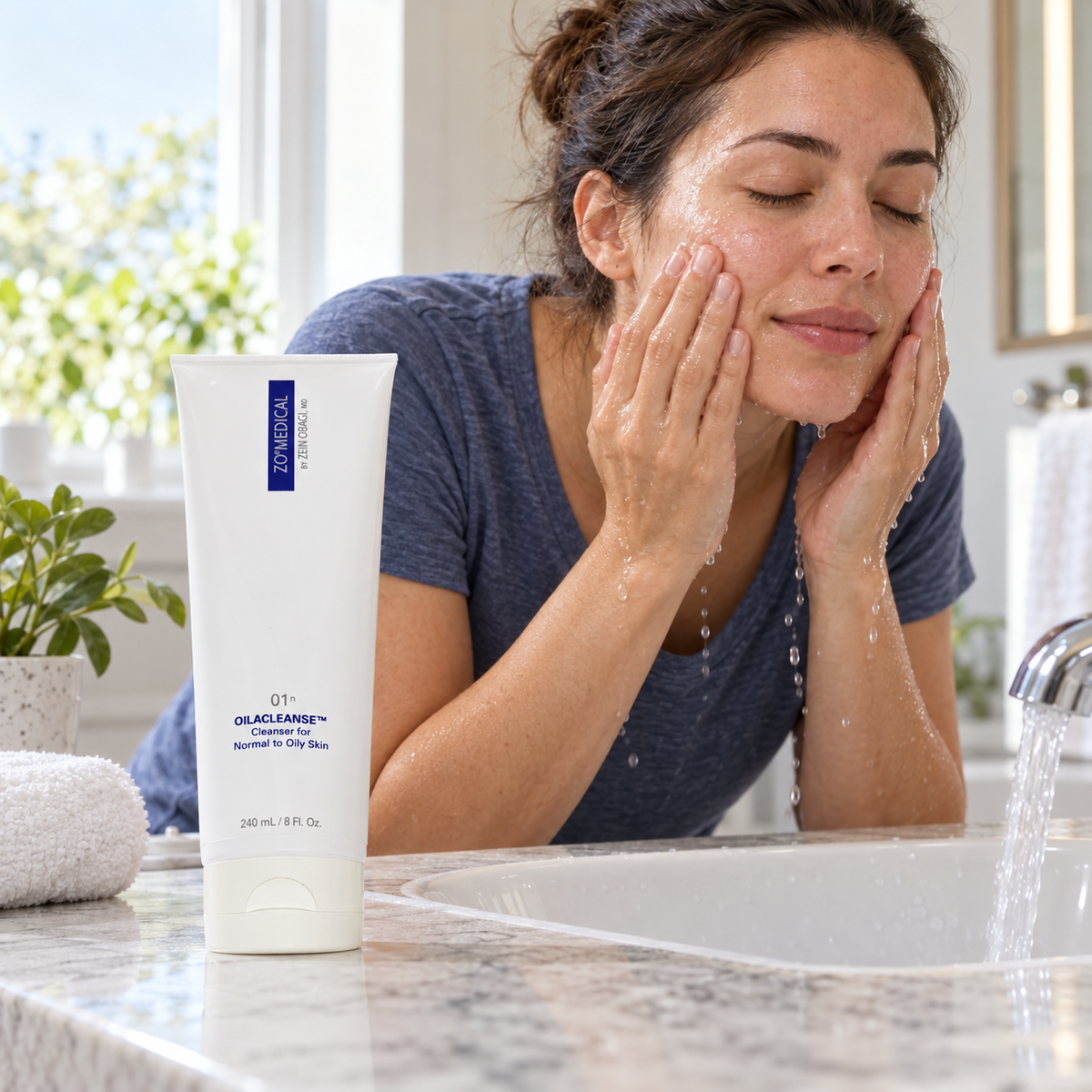 Adult cleansing at a sink with ZO Medical Oilacleanse 240 mL