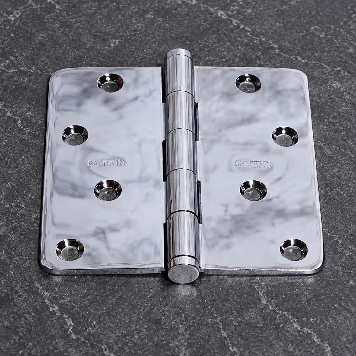 AI-generated close-up: Baldwin chrome hinge with four staggered holes per leaf and five knuckles; this is not an actual stock photo.