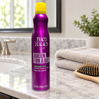 AI-generated lifestyle illustration of one Bed Head TIGI Queen For A Day 10.5 oz can in a home bathroom vanity setting; props not included